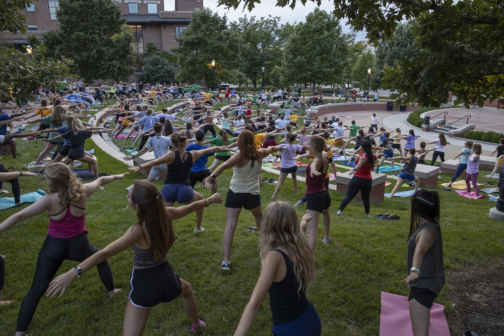Mizzou students take part in Glow Yoga, a Welcome Week tradition